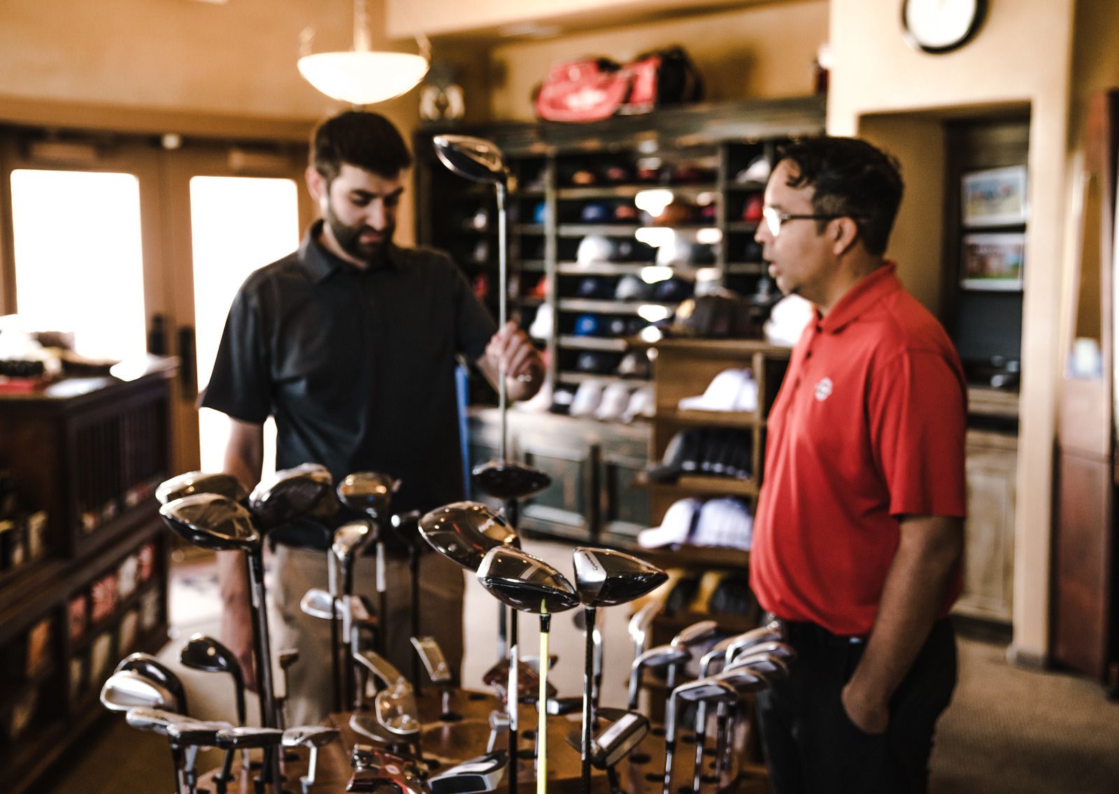 man buying golf clubs